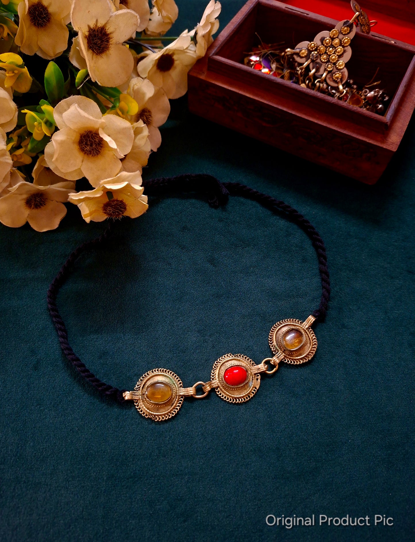 Lightweight Afghan choker with red and amber cabochon stones on a braided black cord. Vintage tribal statement jewellery curated by Panigha India.