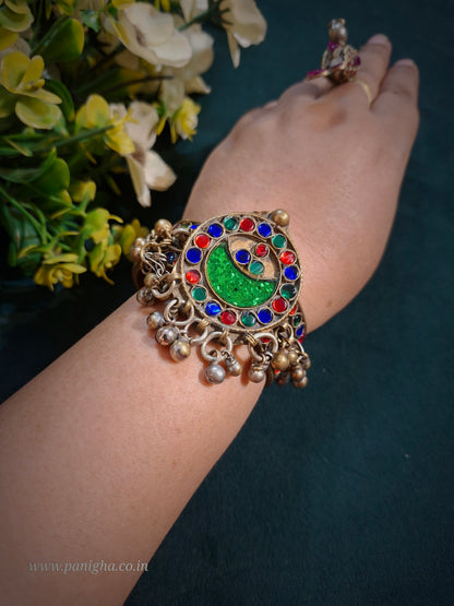 Sabz Chand Vintage Afghan Kada featuring an authentic vintage Afghan crescent motif with green glass inlay and traditional ghungroo dangles.