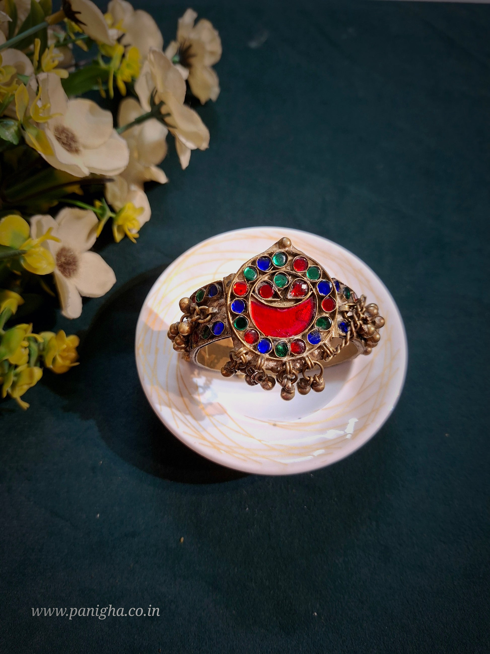 Surkh Chand Vintage Afghan Kada featuring an authentic vintage Afghan red crescent motif with colourful glass inlay and traditional ghungroo dangles.